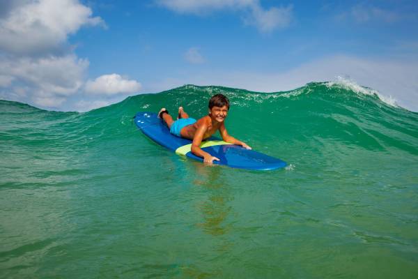 A child enjoying Galveston Texas Surfing.