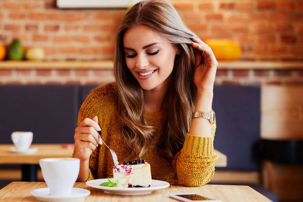 A woman enjoying Dessert In Galveston.